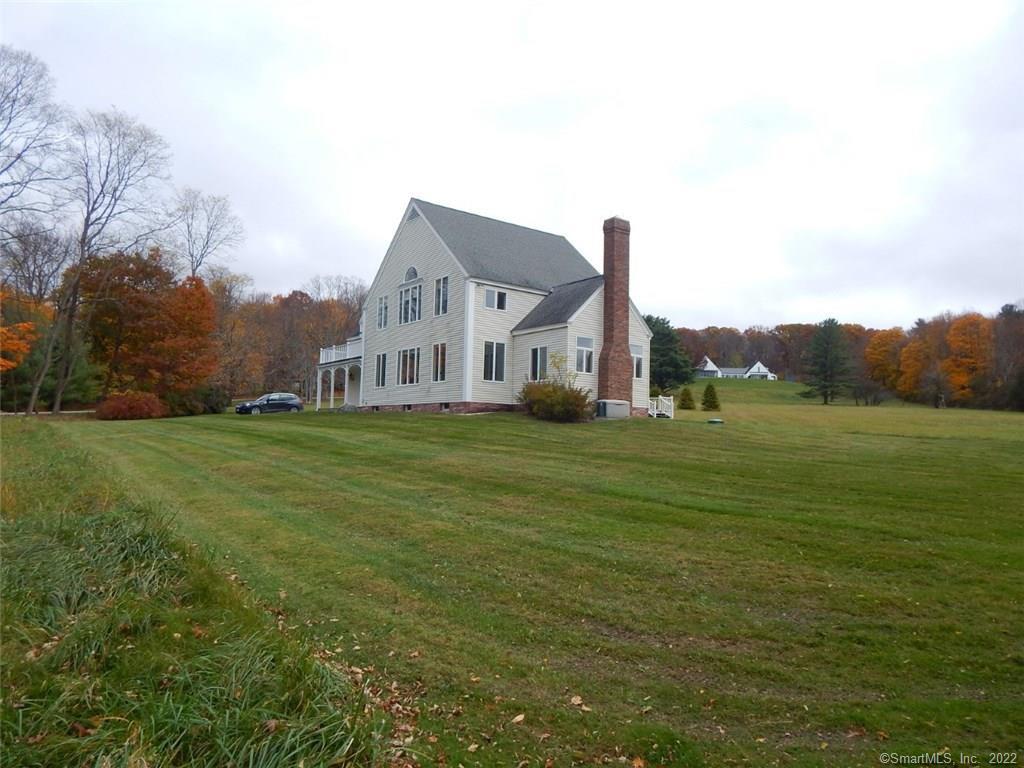 23 Great Elm Road Sharon, CT 06069 - Photo 1 of 1 a front view of a house with a yard