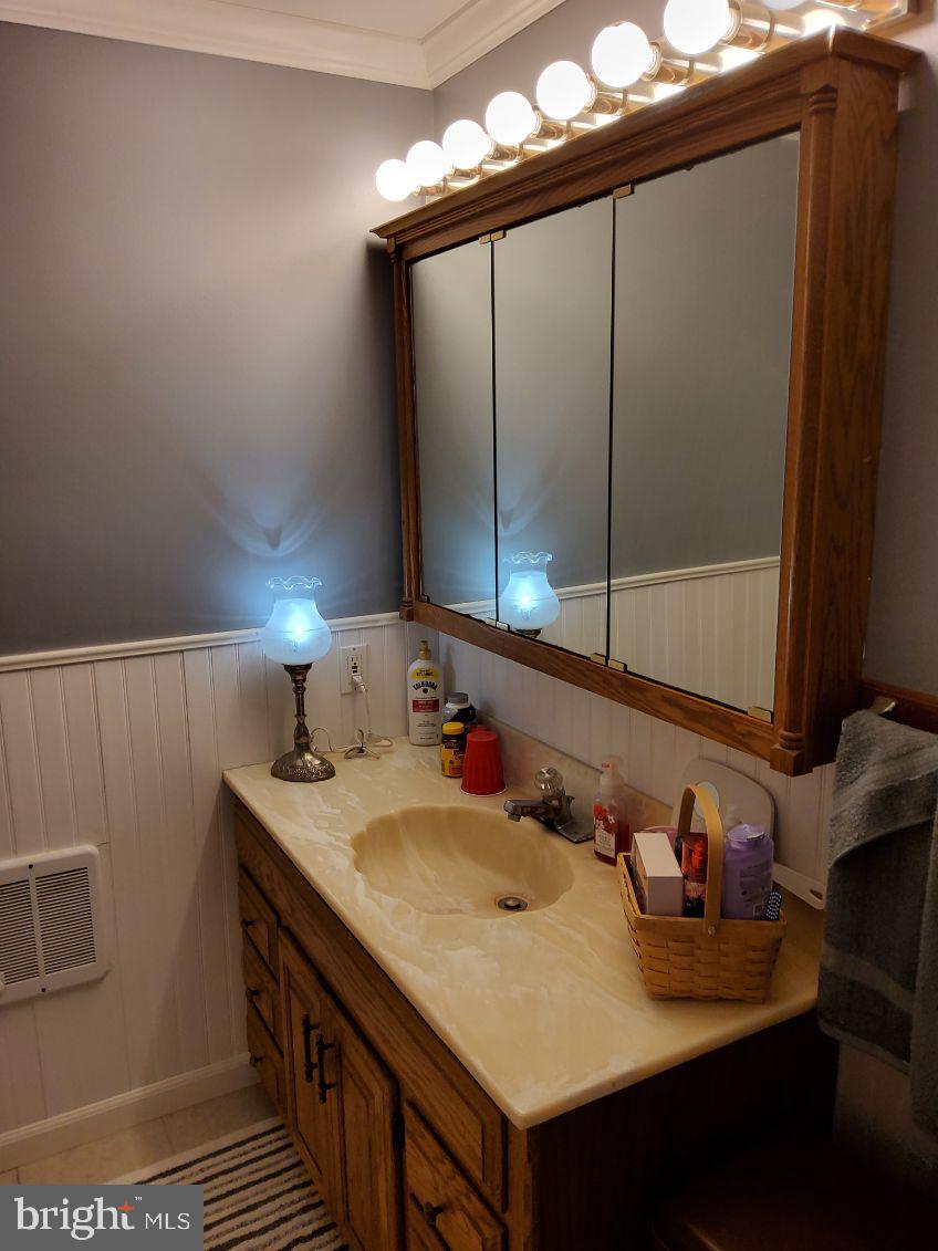 1222 Hillside Road Pasadena, MD 21122 - Photo 8 of 50 Charming bathroom with elegant lighting.