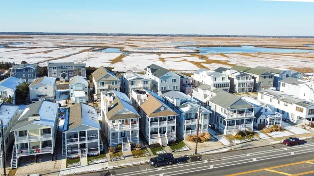 an aerial view of a residential apartment building with a yard
