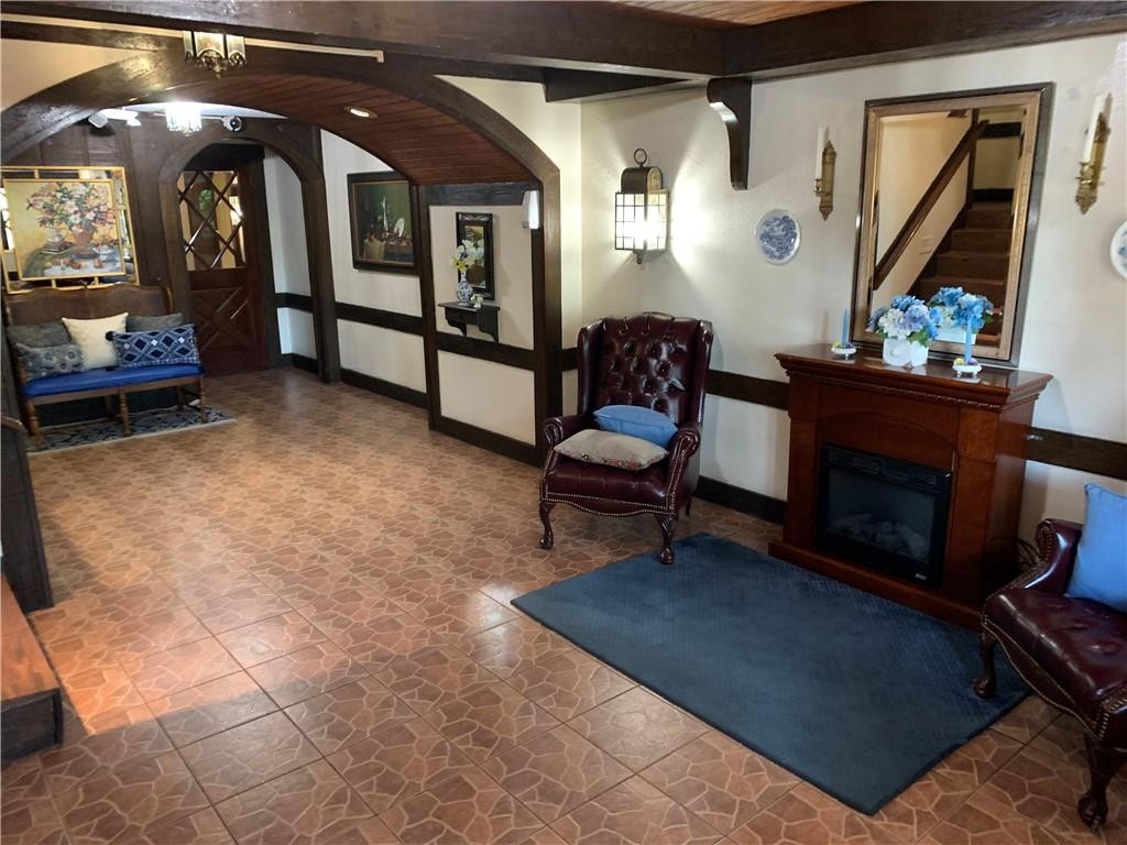 3760 Inverrary Drive, Unit N 1Y Lauderhill, FL 33319 - Photo 11 of 28 a living room with furniture and a fireplace