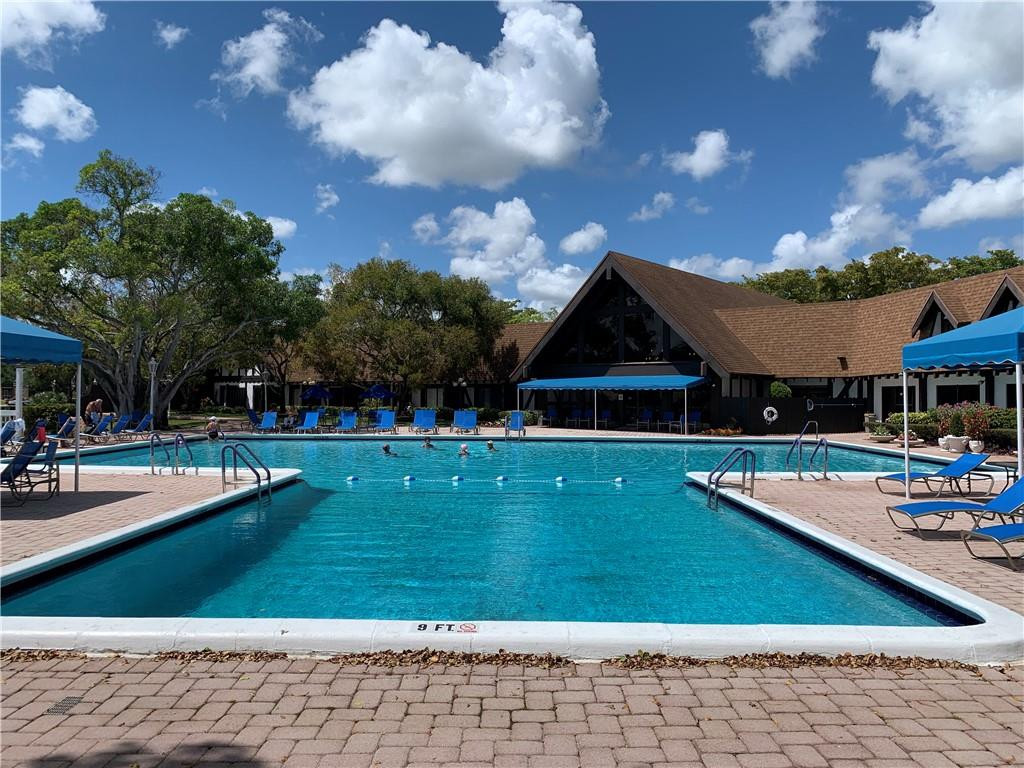 3760 Inverrary Drive, Unit N 1Y Lauderhill, FL 33319 - Photo 14 of 28 a view of a house with swimming pool and sitting area