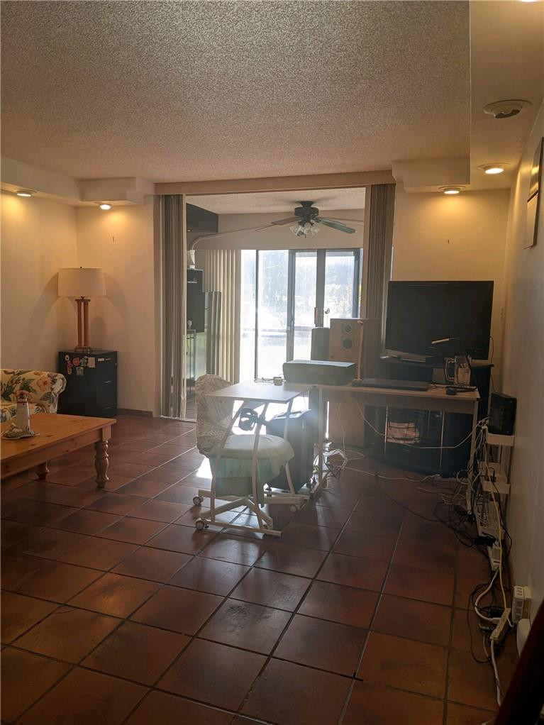 3760 Inverrary Drive, Unit N 1Y Lauderhill, FL 33319 - Photo 2 of 28 a lobby with furniture and a potted plant