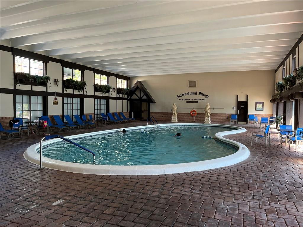 3760 Inverrary Drive, Unit N 1Y Lauderhill, FL 33319 - Photo 24 of 28 a view of a swimming pool with seating space