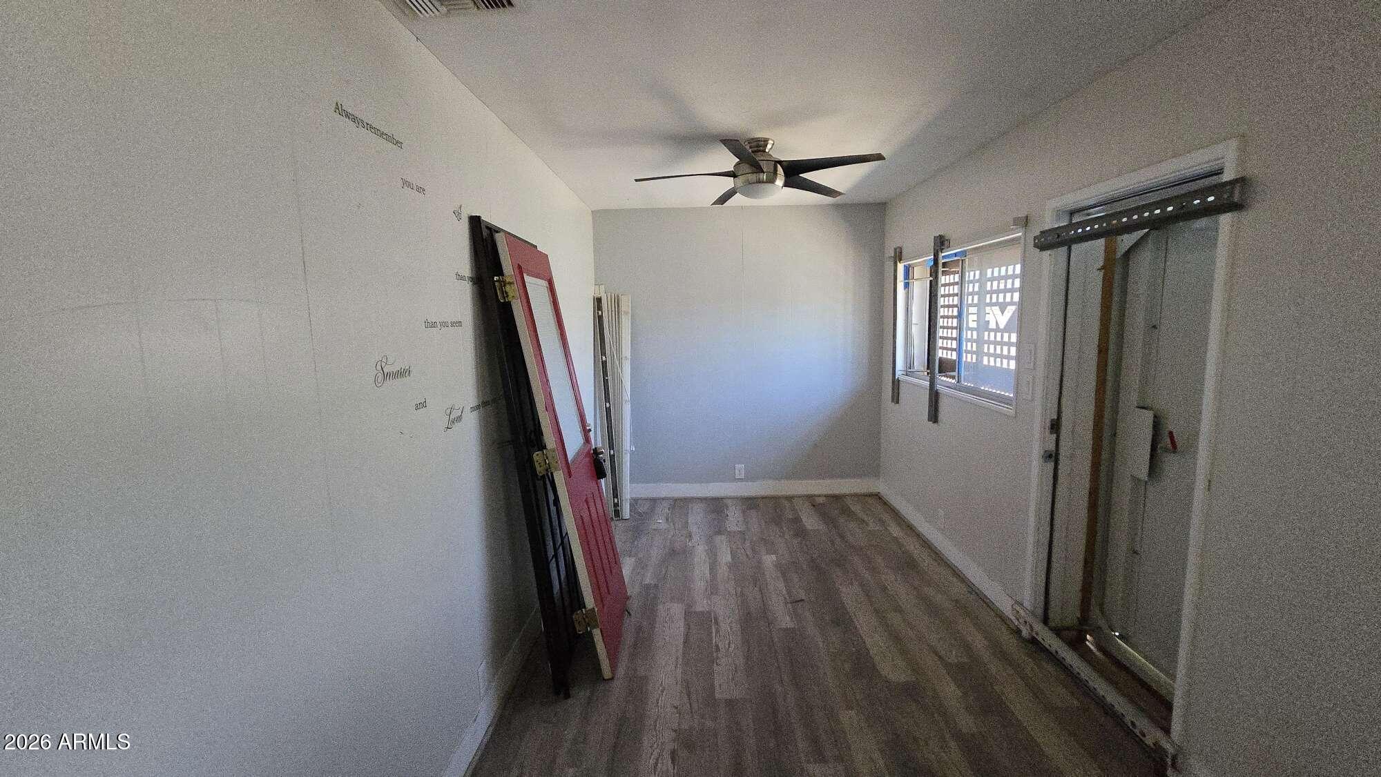 834 West Osborn Road Phoenix, AZ 85013 - Photo 36 of 45 a view of hallway with stairs and wooden floor