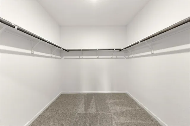 a bathroom with a double vanity sink mirror and shower