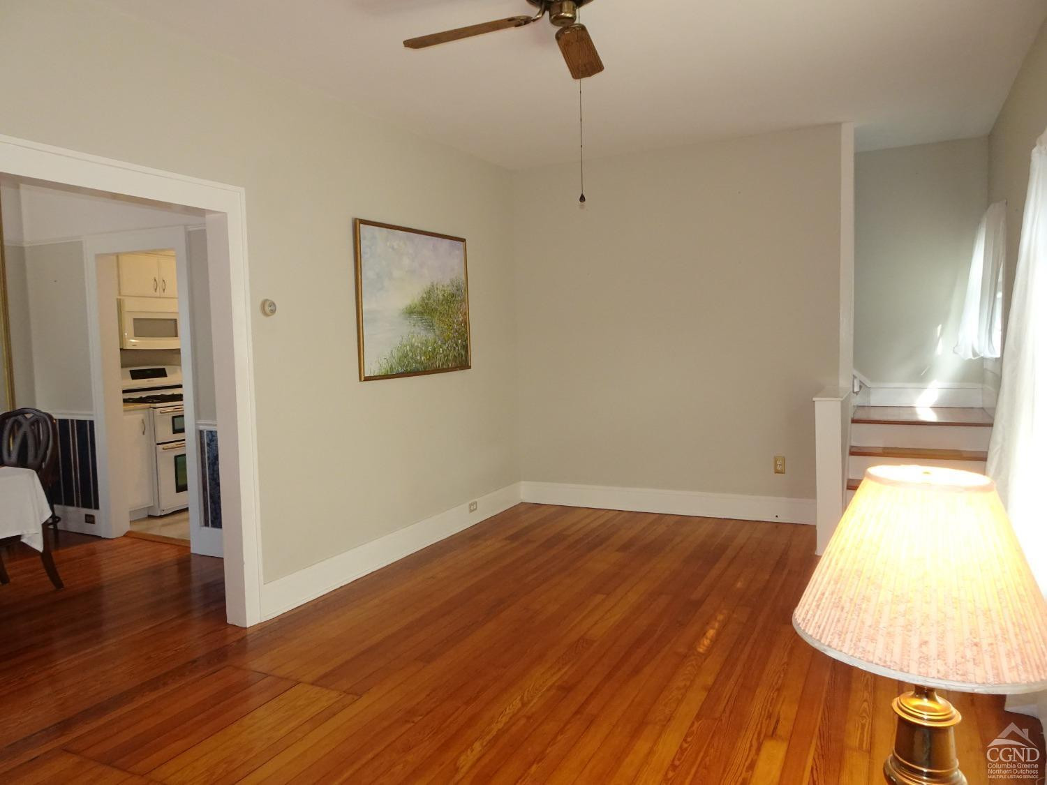 161 Highway 23 Claverack, NY 12513 - Photo 11 of 56 an empty room with wooden floor and windows