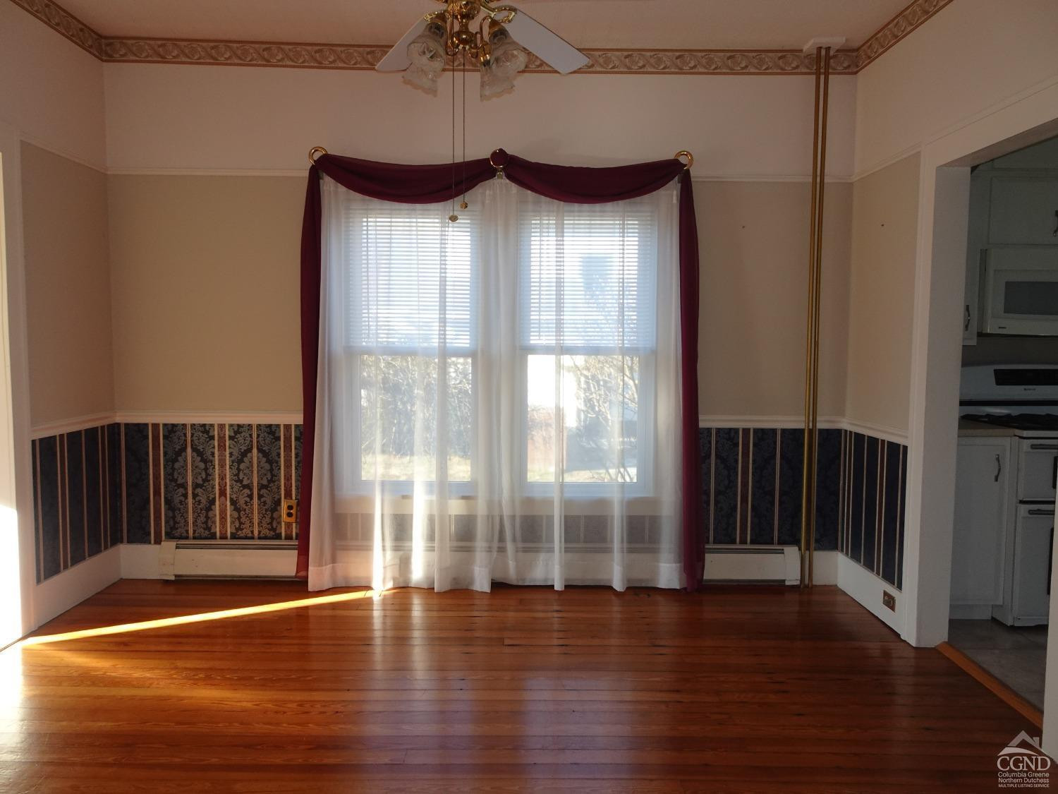 161 Highway 23 Claverack, NY 12513 - Photo 13 of 56 a view of a livingroom with wooden floor and a window