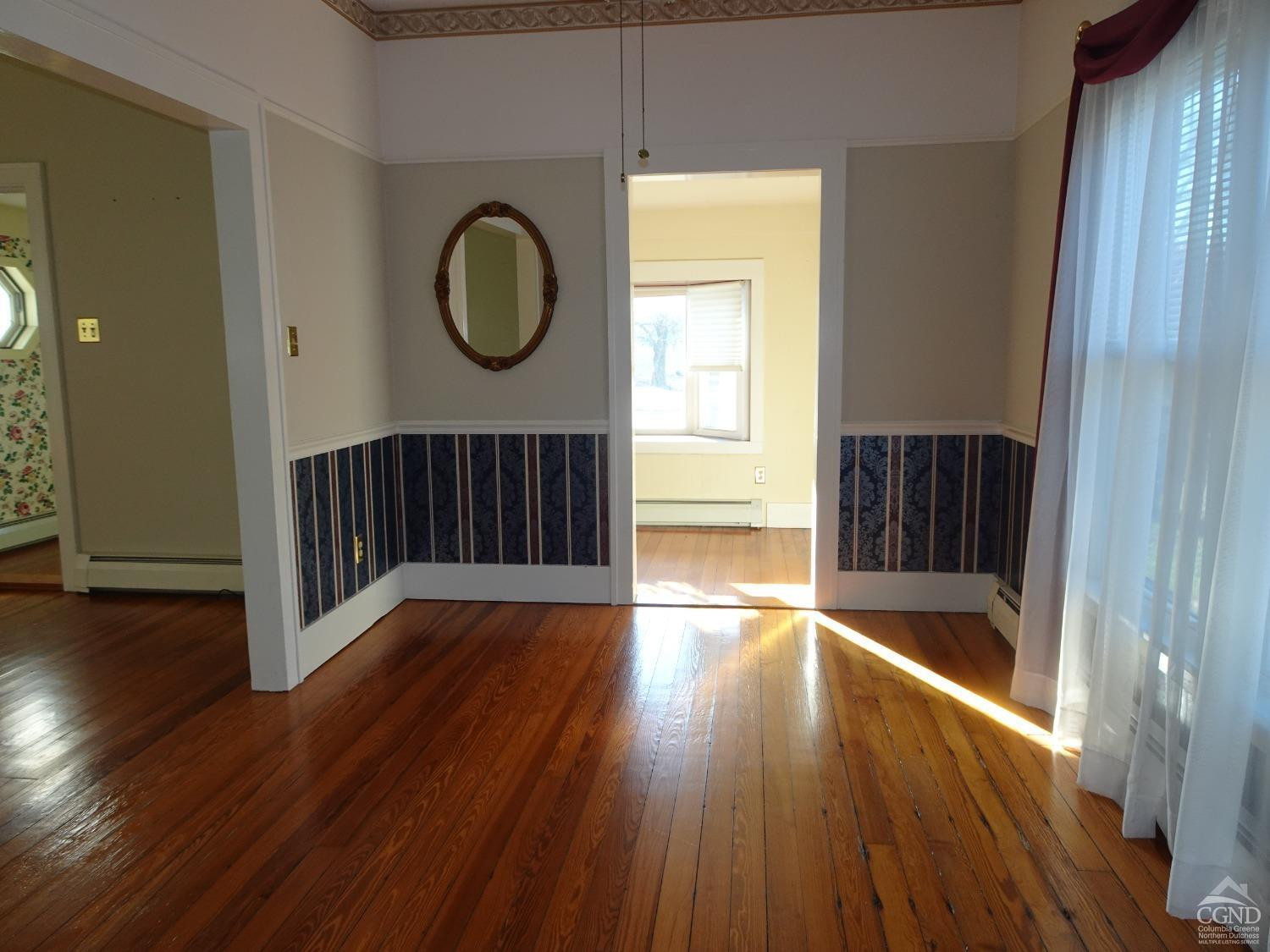 161 Highway 23 Claverack, NY 12513 - Photo 14 of 56 a view of an empty room with wooden floor and a window