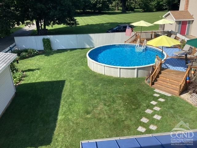 161 Highway 23 Claverack, NY 12513 - Photo 4 of 56 a view of a swimming pool with an outdoor space and seating area