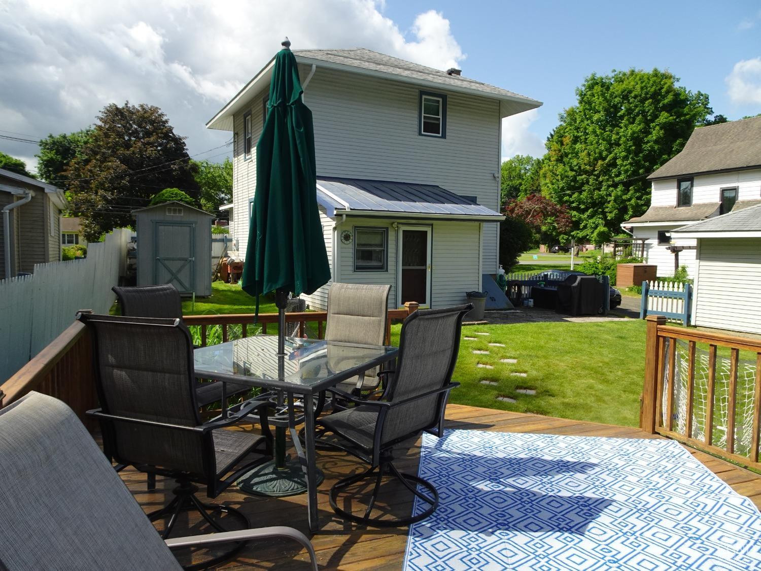 161 Highway 23 Claverack, NY 12513 - Photo 44 of 56 a view of a patio with table and chairs potted plants and floor to ceiling window
