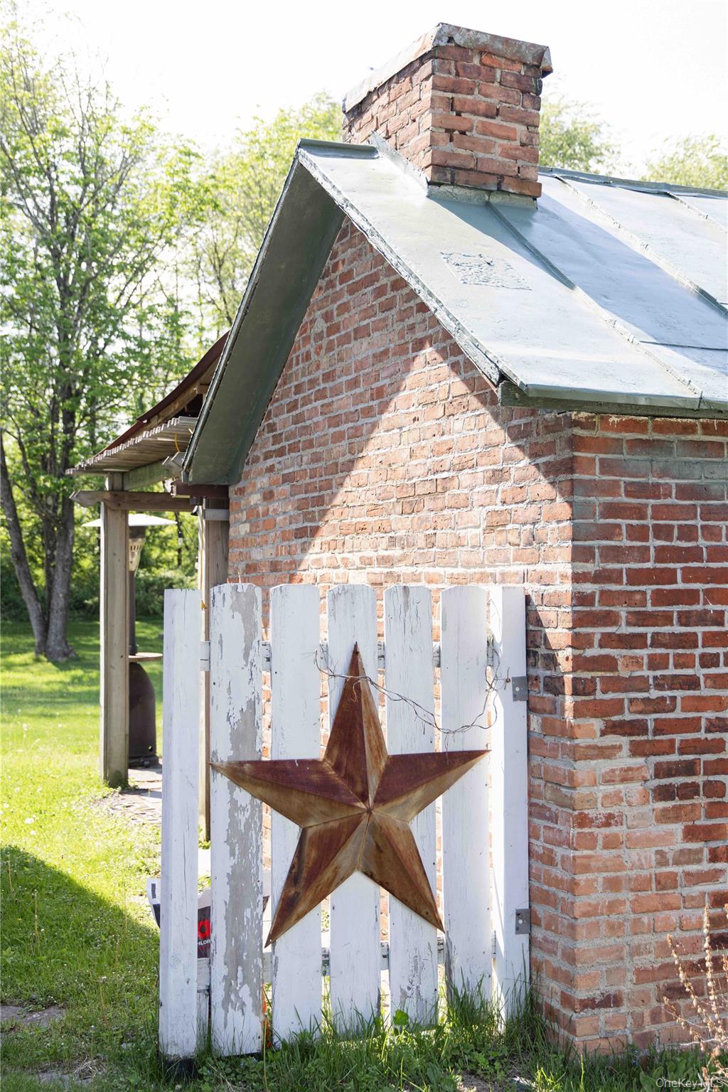210 Middle Road Hudson, NY 12534 - Photo 4 of 42 Brick exterior with a metal roof and a prominent brick chimney