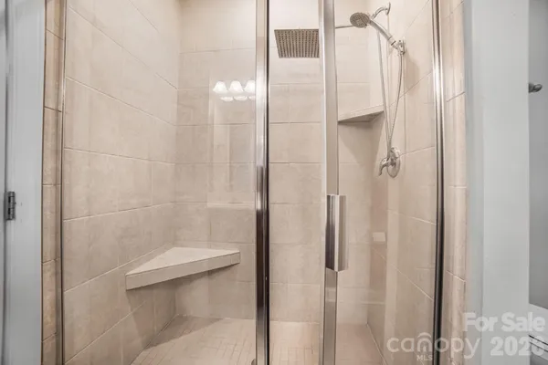 a bathroom with a shower and toilet
