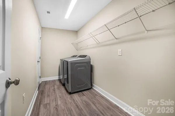 a view of a storage & utility room with wooden floor