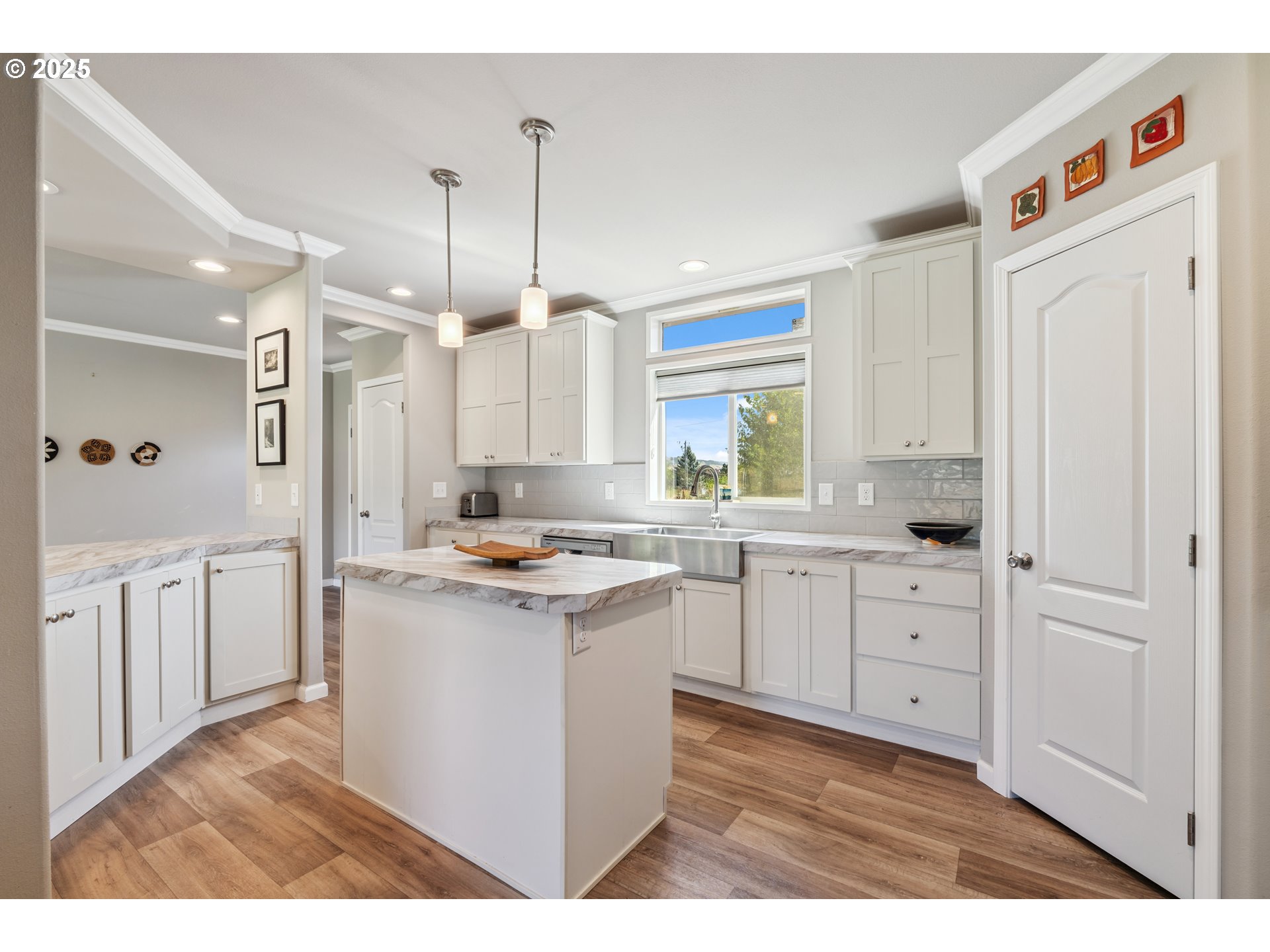 1682 Markham Road Hood River, OR 97031 - Photo 14 of 22 a kitchen with white cabinets and white appliances