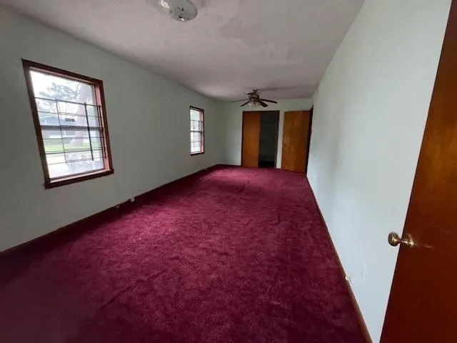 an empty room with windows