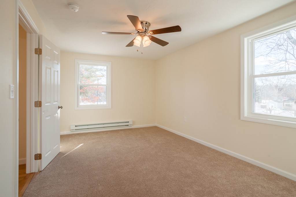 98 Indian Run Road Bellingham, MA 02019 - Photo 17 of 30 a view of an empty room with a window