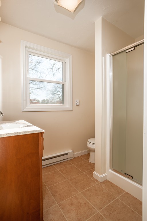 98 Indian Run Road Bellingham, MA 02019 - Photo 18 of 30 a view of an empty room with a bathroom and a window