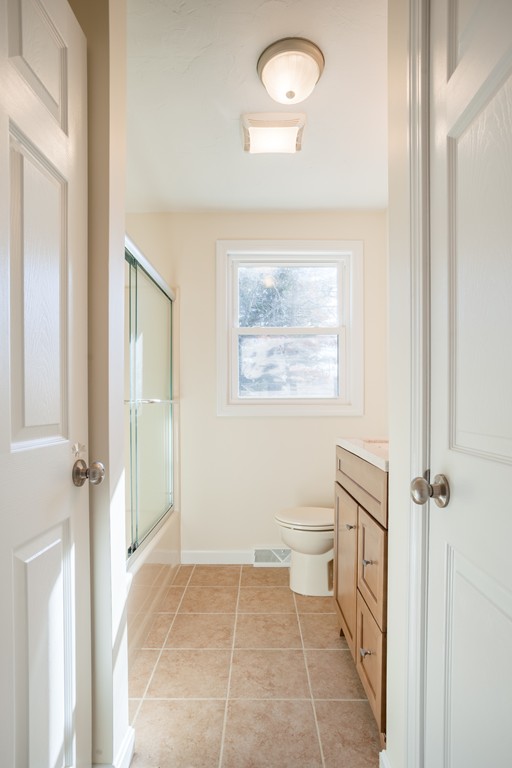 98 Indian Run Road Bellingham, MA 02019 - Photo 22 of 30 a bathroom with a toilet a sink and a mirror
