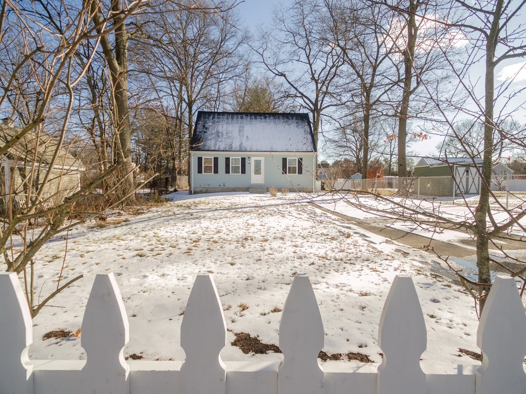 98 Indian Run Road Bellingham, MA 02019 - Photo 29 of 30 a view of a house with a yard covered in snow