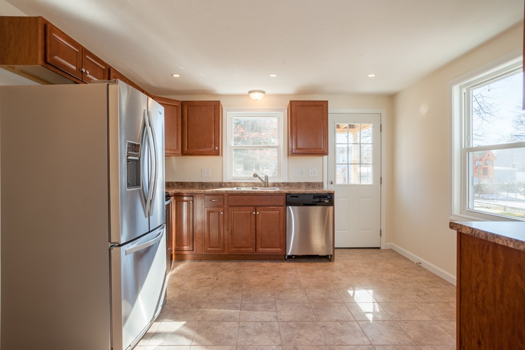 98 Indian Run Road Bellingham, MA 02019 - Photo 3 of 30 a kitchen with stainless steel appliances granite countertop a refrigerator and a stove