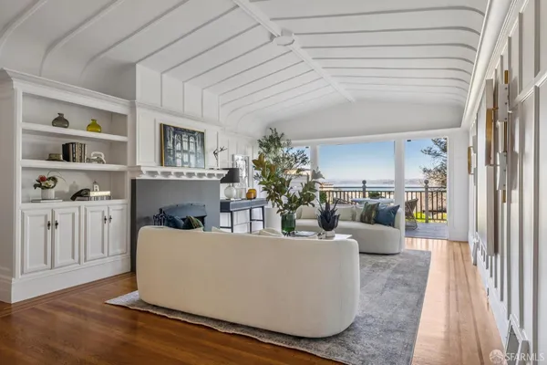 a view of a house with wooden deck