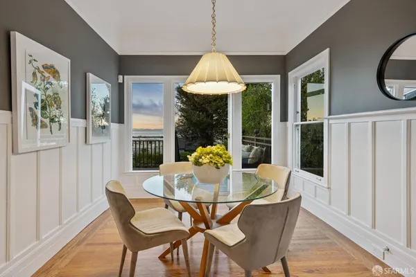 a living room filled with furniture and a large window