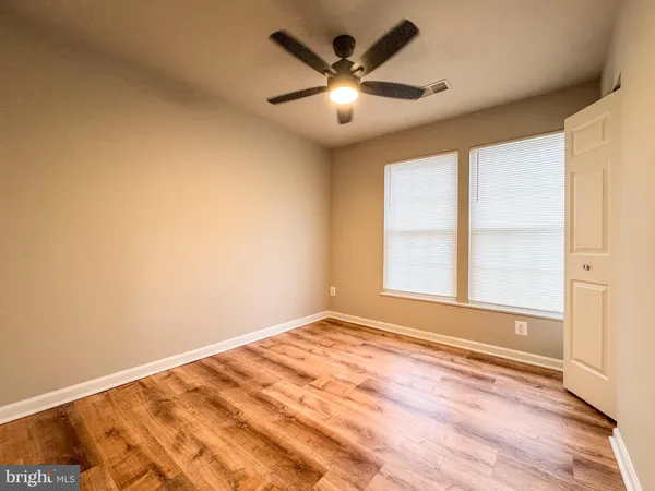a bathroom with a sink mirror vanity and toilet