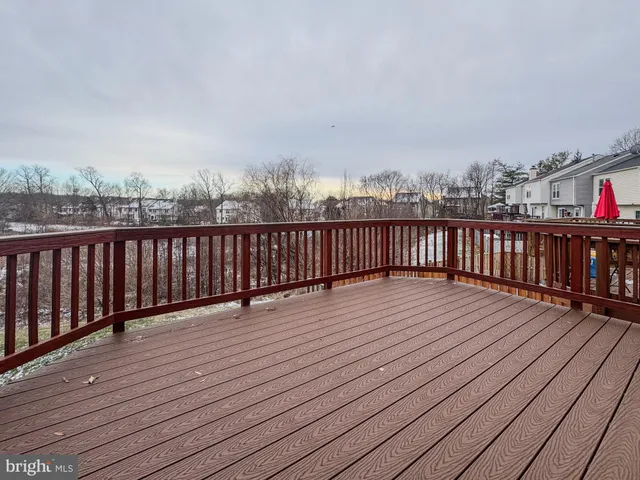 a view of balcony with wooden floor