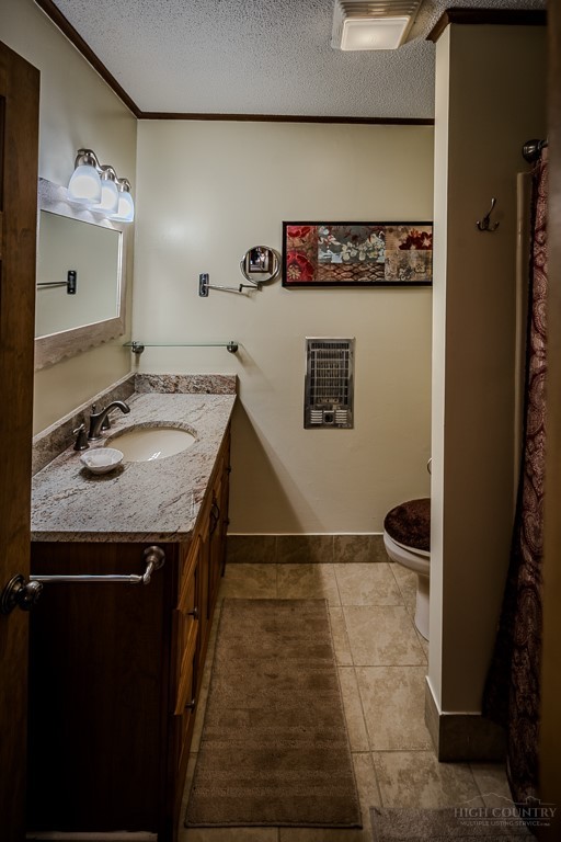 103-105 Upper Grouse Ridge Road Beech Mountain, NC 28604 - Photo 24 of 48 a bathroom with a granite countertop sink and a mirror