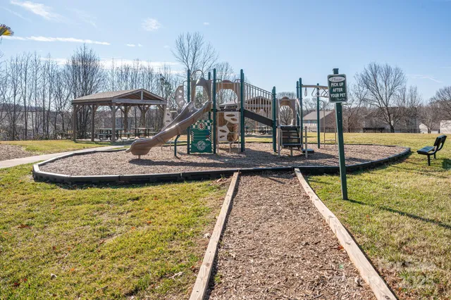 a view of house with yard and entertaining space