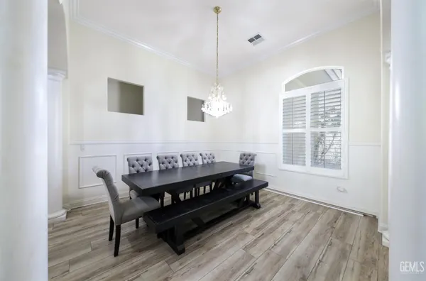 a living room with couches and a flat screen tv