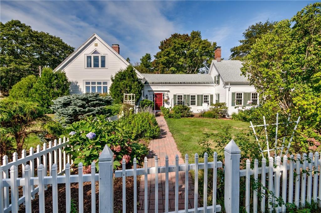 12 Leeman Road Orrs Island, ME 04066 - Photo 2 of 34 A picket fence surrounds the...