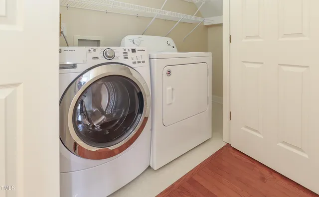 a utility room with dryer and washer