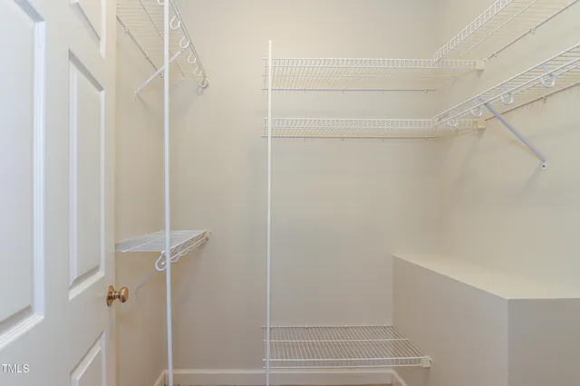 a bathroom with a double vanity sink mirror and toilet