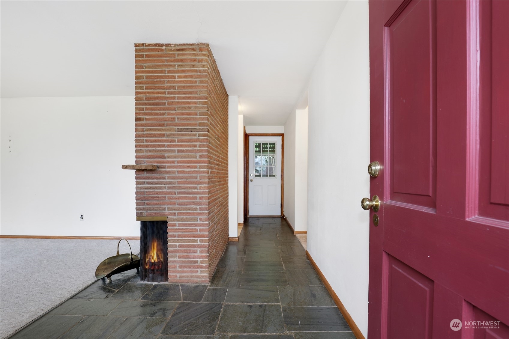 1608 Shattuck Avenue South Renton, WA 98055 - Photo 3 of 38 a view of a hallway with a chair and a potted plant