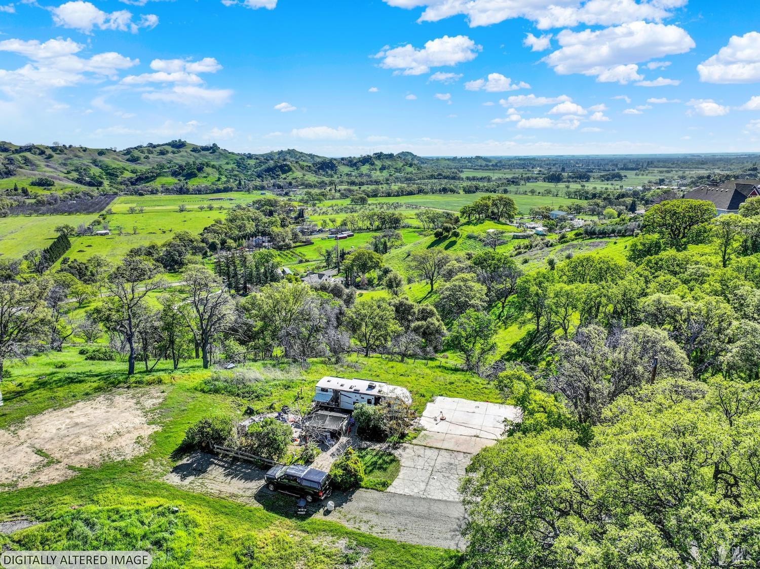 6958 Oak Tree Trail Vacaville, CA 95688 - Photo 13 of 22 a view of a city with lush green forest