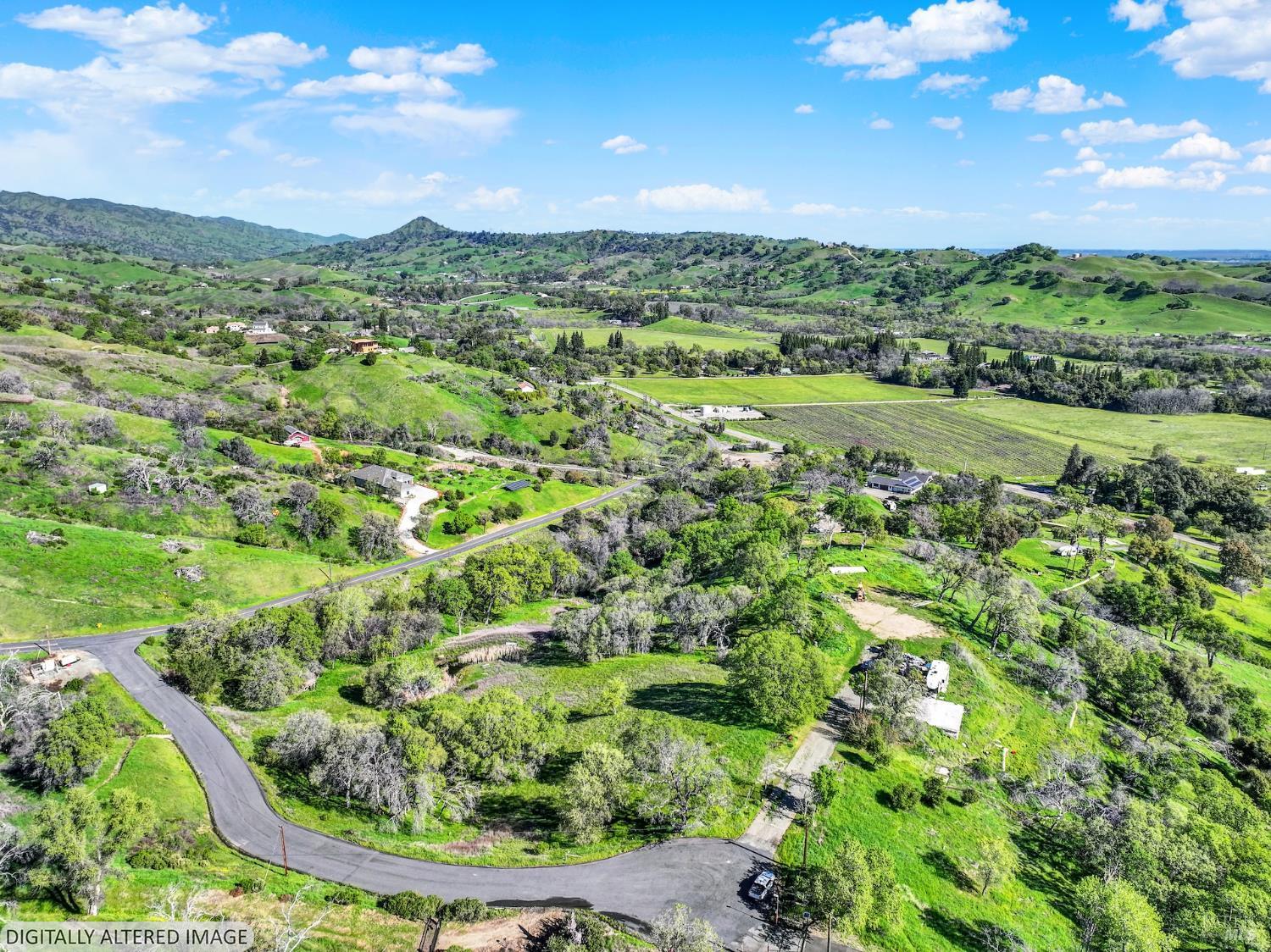 6958 Oak Tree Trail Vacaville, CA 95688 - Photo 7 of 22 a view of a lush green outdoor space with a lake view
