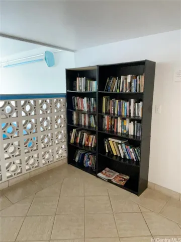 a view of a patio with a table and chairs and potted plants