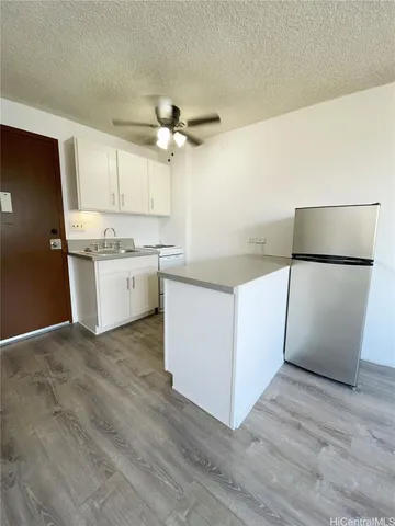 a kitchen with a cabinets and window