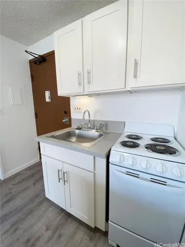 a room with cabinets and wooden floor