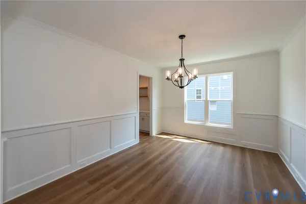 a spacious bathroom with a granite countertop sink a mirror and a bathtub