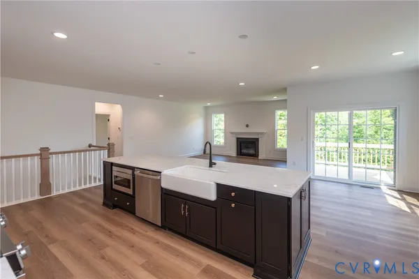a kitchen with a sink and natural light