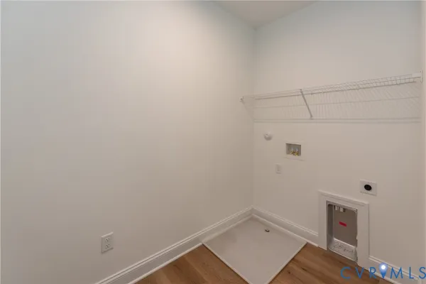 a kitchen with granite countertop white cabinets and stainless steel appliances