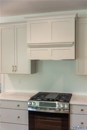 a front view of a house with a yard and porch