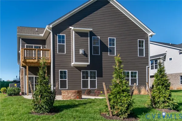 a front view of a house with a yard and porch