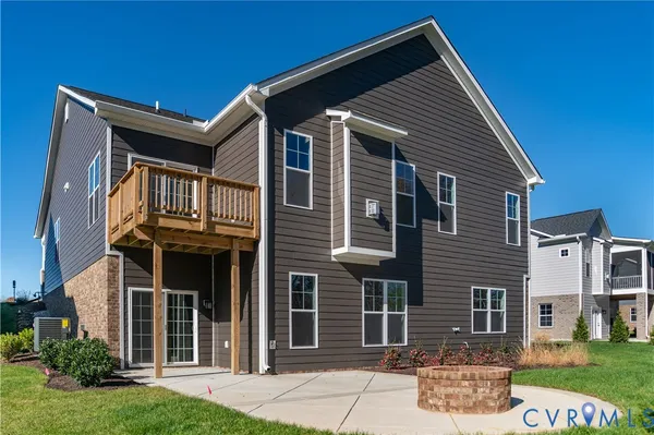 a view of a pathway of a house with wooden fence