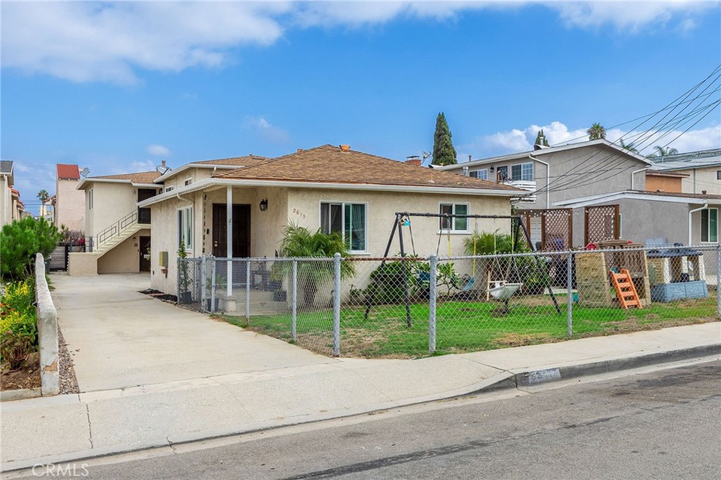 2615 Rockefeller Lane Redondo Beach, CA 90278 - Photo 2 of 33 a front view of a house with a yard and potted plants