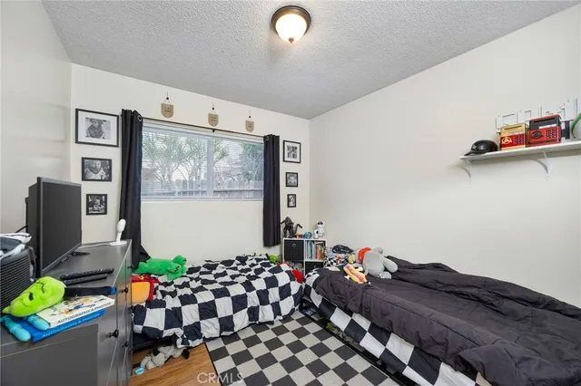 a bed room with furniture and a window