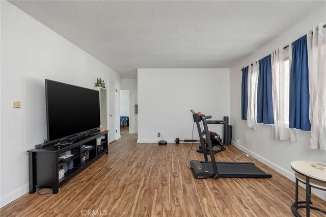 a view of a livingroom with furniture and a flat screen tv