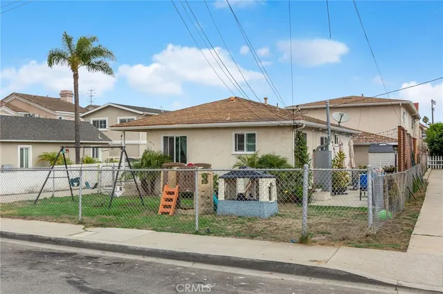 a front view of a house with a yard and porch